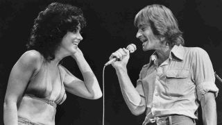 Grace Slick & Marty Balin perform with Jefferson Starship onstage in 1976