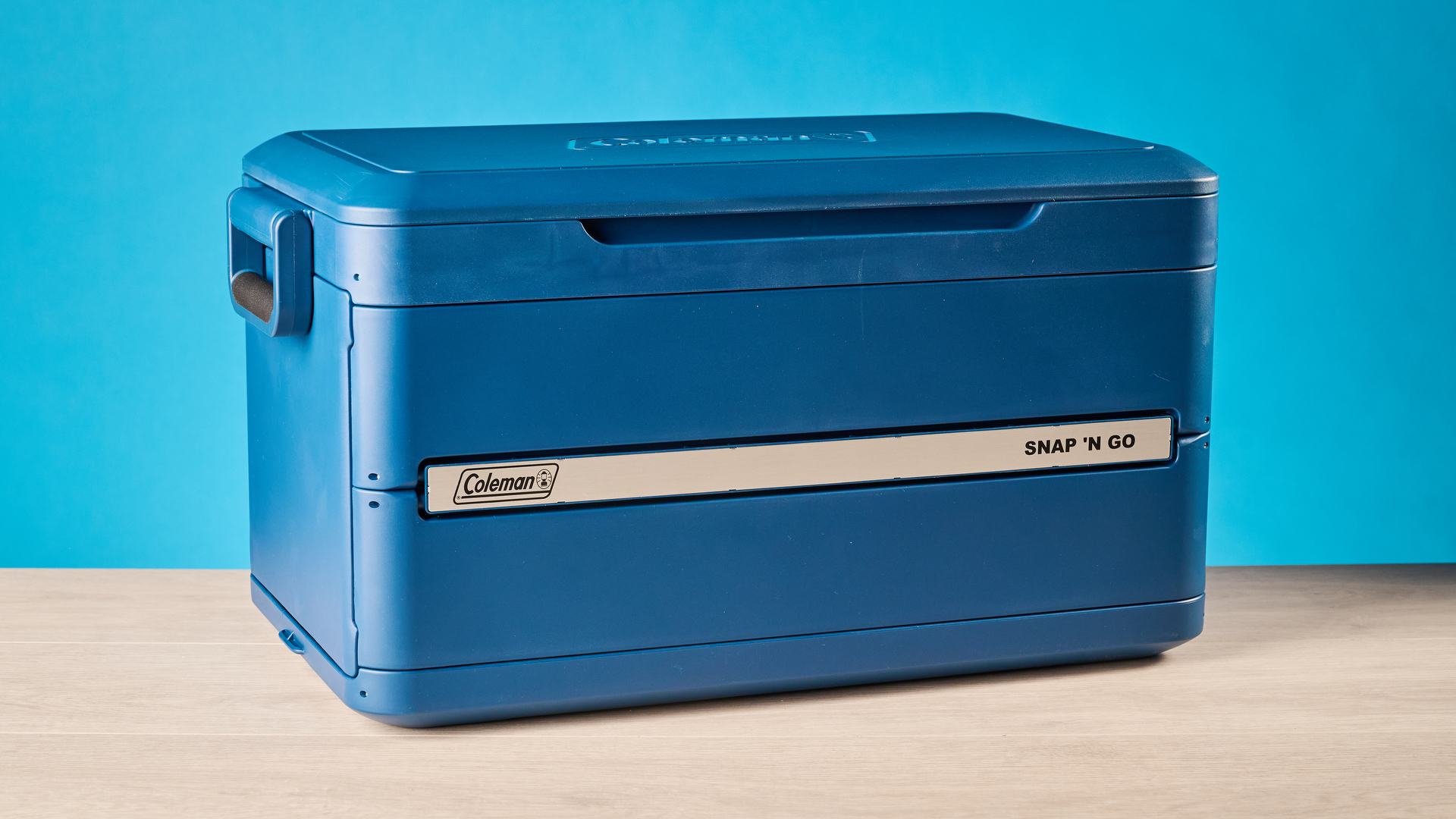 the coleman snap 'n go collapsible cooler photographed with the blue tom's guide background