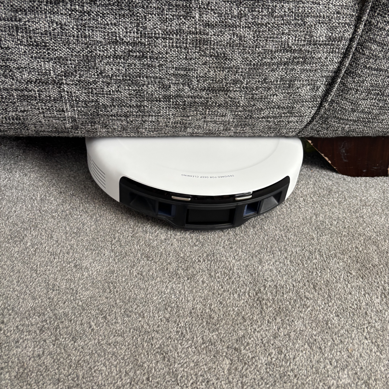 eufy C10 positioned underneath sofa