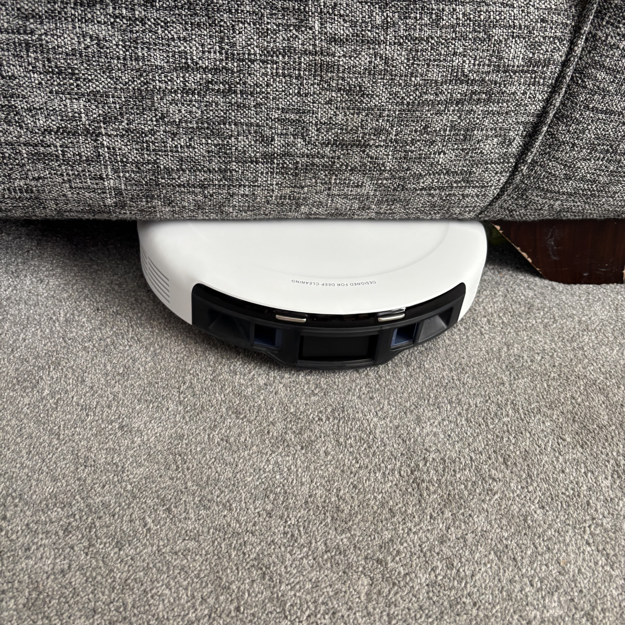 eufy C10 positioned underneath sofa