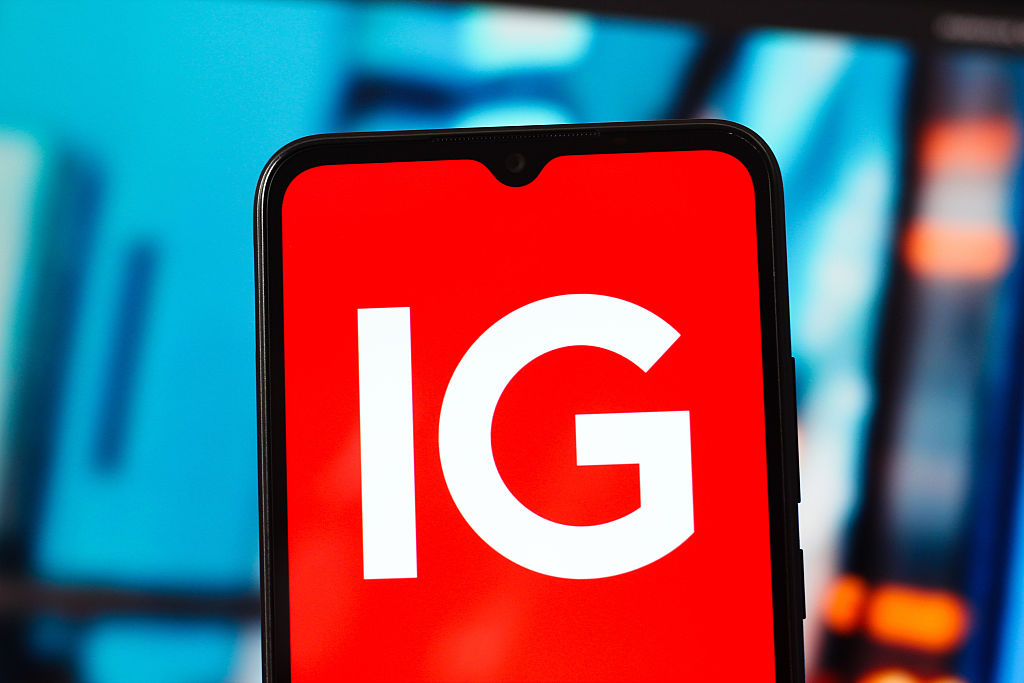 IG Group logo on a phone screen