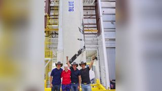 The crew of Blue Origin's First Human Flight mission pose with their New Shepard rocket ahead of their planned launch on July 20, 2021 They are (From left): Oliver Daemen, Wally Funk, Jeff Bezos and his brother Mark Bezos.