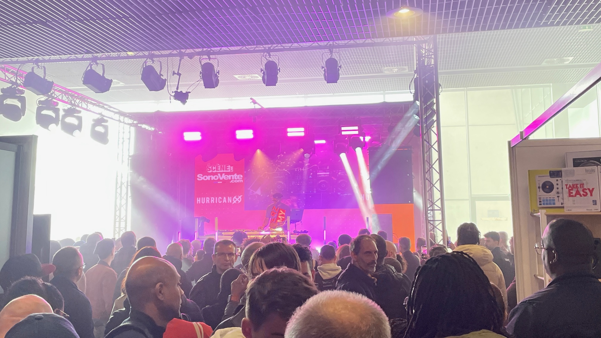 A DJ set at the Paris Audio Show 2025, with a DJ onstage