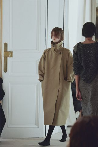 a model walks The Row winter 2025 runway during Paris Fashion Week