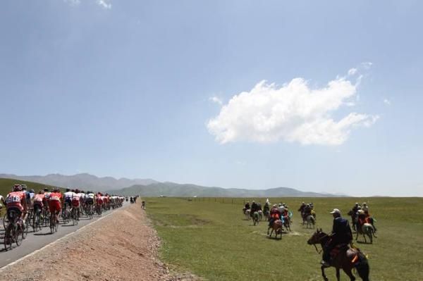 Some horse men rode along side the riders.