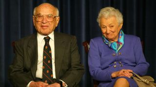 Milton Friedman pictured with his wife, Rose May, during a White House event in 2002