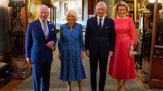 King Charles III and Queen Camilla stand with the King Philippe of Belgium and Queen Mathilde of Belgium