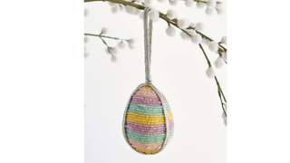 A beaded striped rainbow hanging egg decoration - one of the best Easter decorations