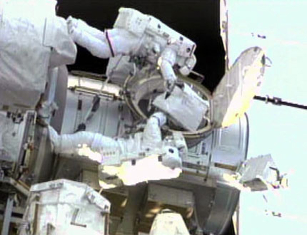 Endeavour shuttle Andrew Feustel (top) and Mike Fincke conduct the second spacewalk of their STS-134 mission at the International Space Station on May 22, 2011 (Flight Day 7). 