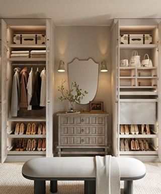 open walk in closet in neutral tones with a vintage wooden cabinet