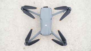DJI Air 3 drone viewed from above with its propellers out.