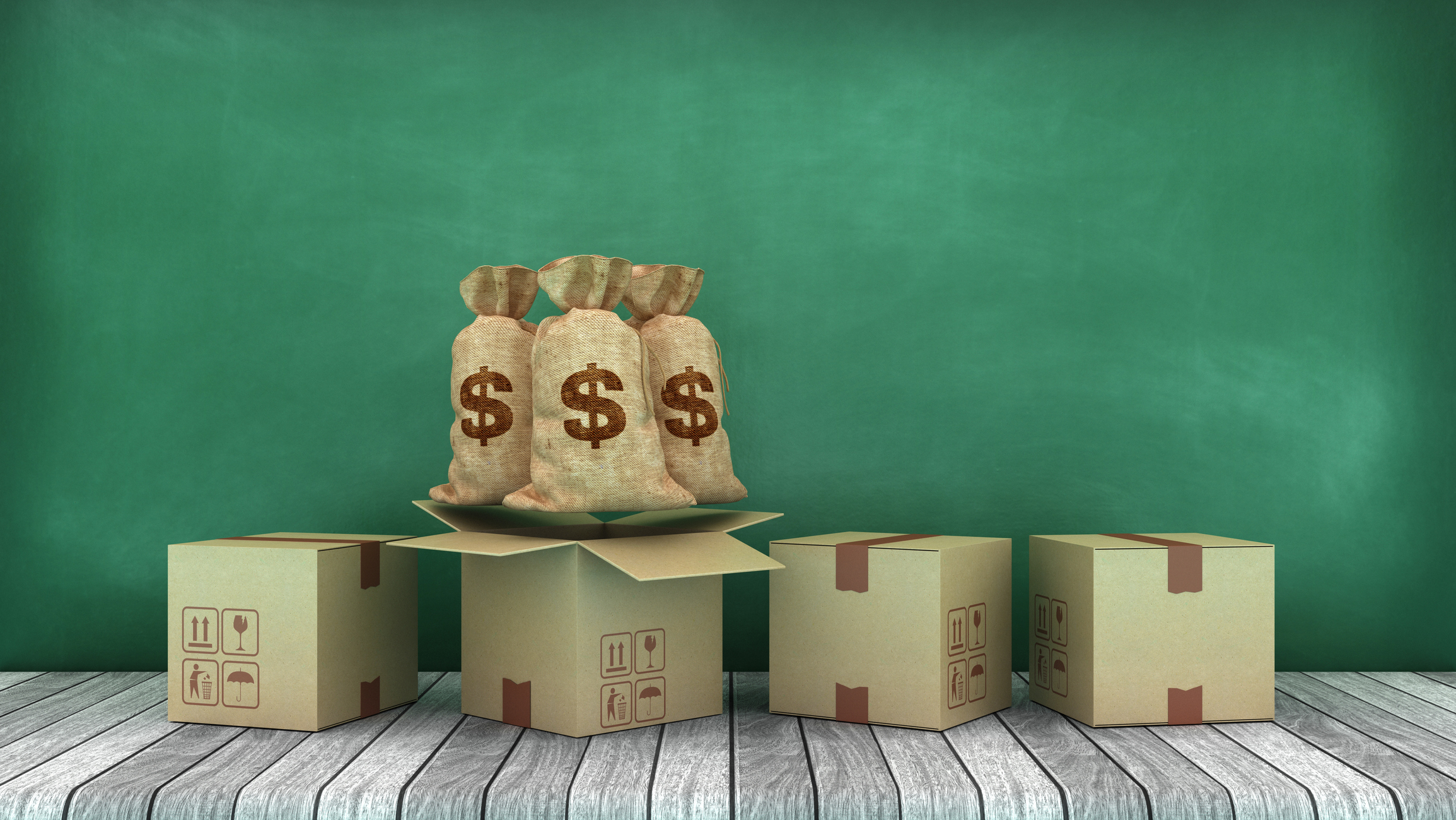 Cardboard boxes with dollar money sacks against a green chalkboard background 