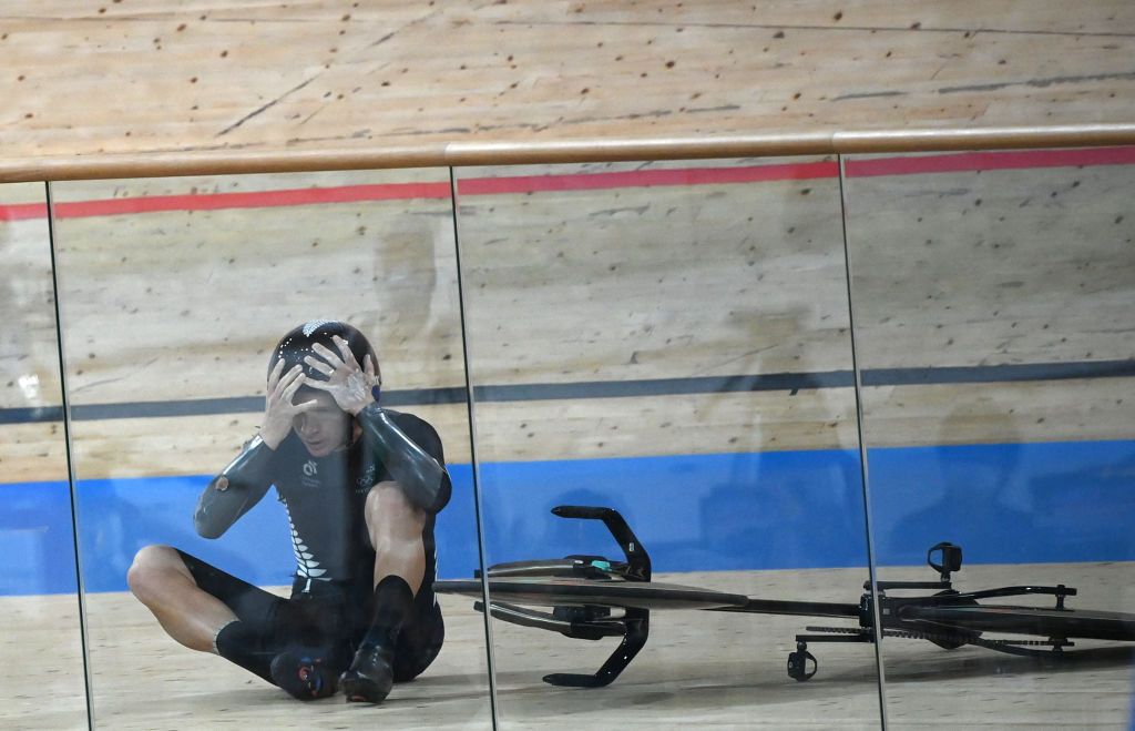 New Zealands Aaron Gate reacts after crashing during the mens track cycling team pursuit finals during the Tokyo 2020 Olympic Games at Izu Velodrome in Izu Japan on August 4 2021 Photo by Greg Baker AFP Photo by GREG BAKERAFP via Getty Images