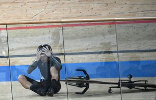 New Zealands Aaron Gate reacts after crashing during the mens track cycling team pursuit finals during the Tokyo 2020 Olympic Games at Izu Velodrome in Izu Japan on August 4 2021 Photo by Greg Baker AFP Photo by GREG BAKERAFP via Getty Images