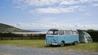 Campsites by the beach: A tent and VW Camper at Ocean Pitch campsite on the beach