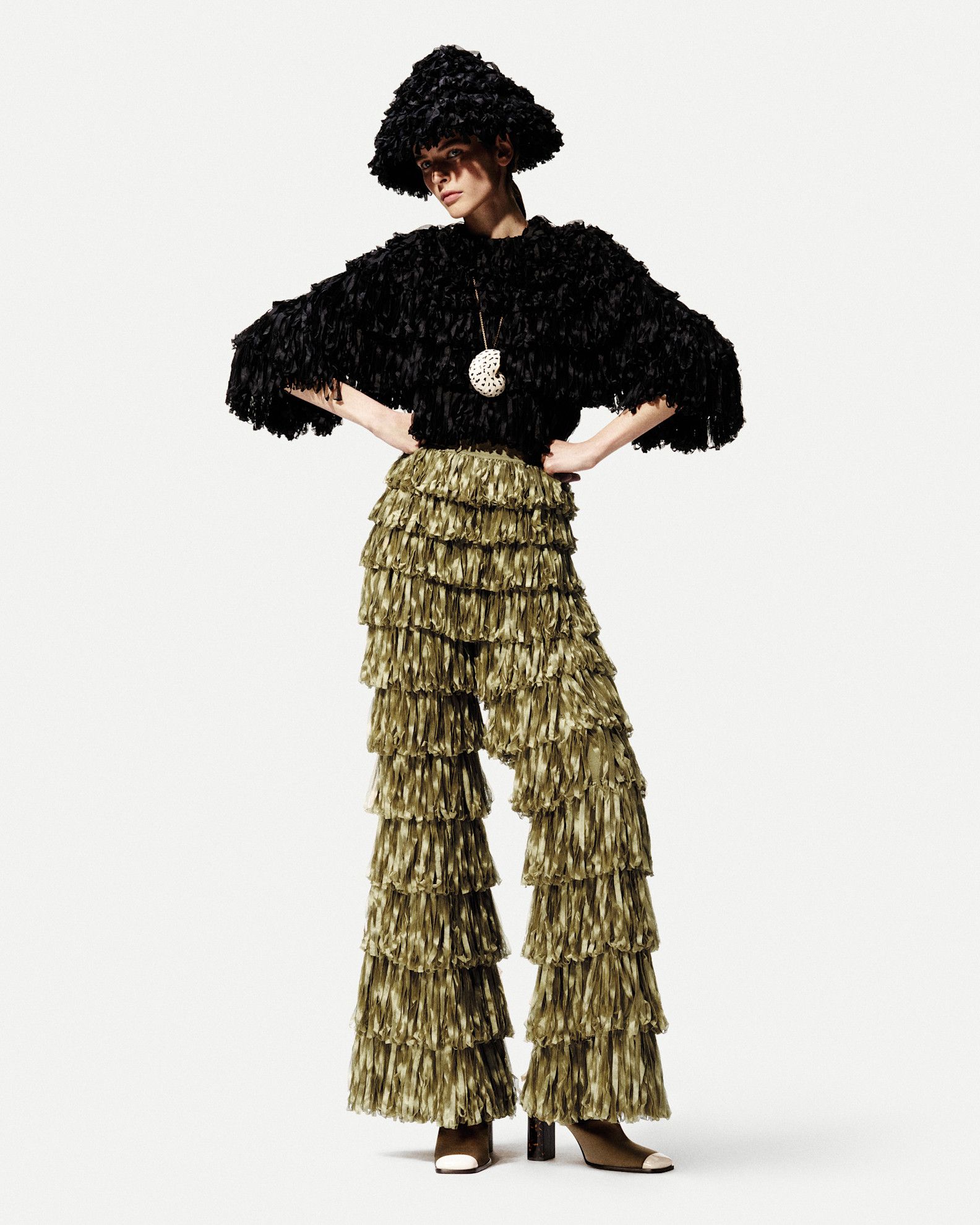A model in the S/S 26 Loro Piana lookbook wearing dipped-toe shoes.