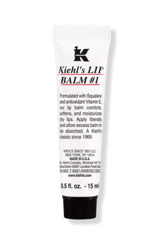 A black and white unopened tube of Kihel's LIP BALM #1 set against a white background.