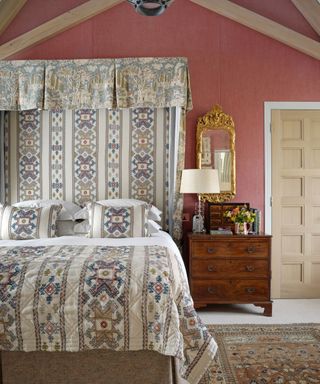 Bedroom with patterned bed and canopy in Kit Kemp's house