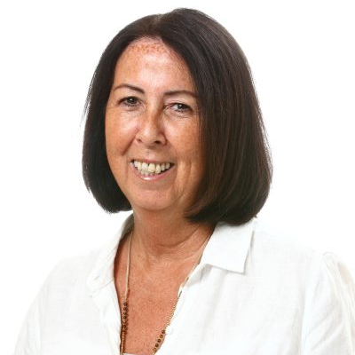female with dark brown bob wearing white blouse