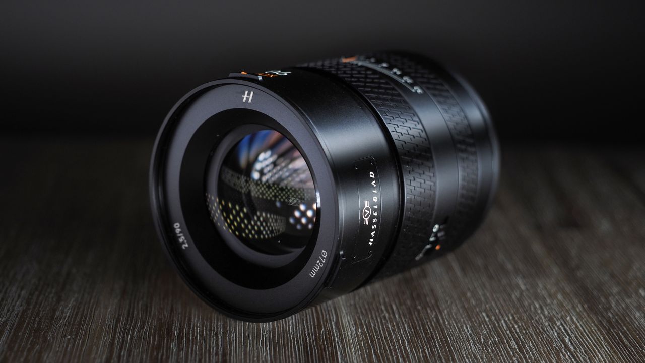 Hasselblad XCD 90V on a wooden surface against a dark background