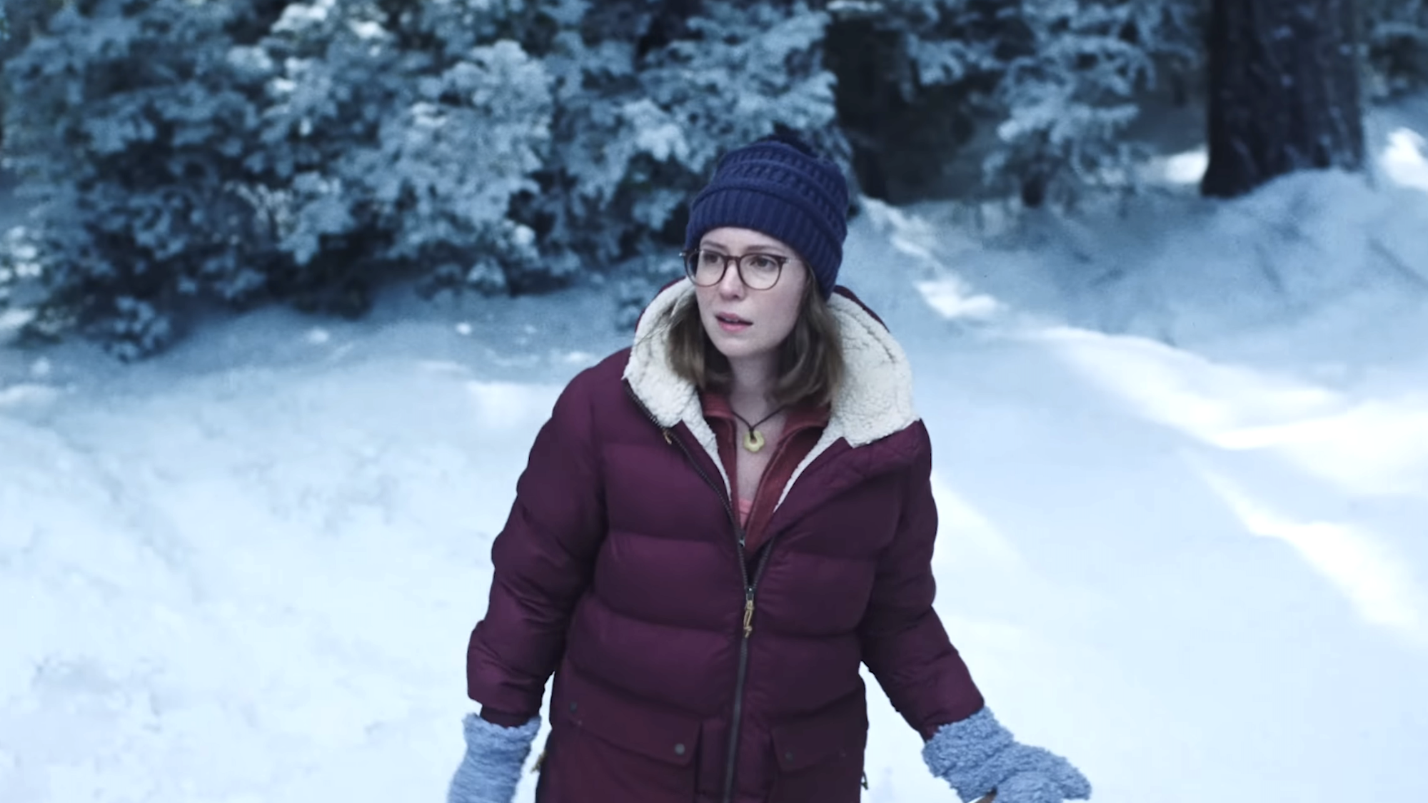 Hannah Einbinder walking through the snow in Teenage Sex and Death At Camp Miasma