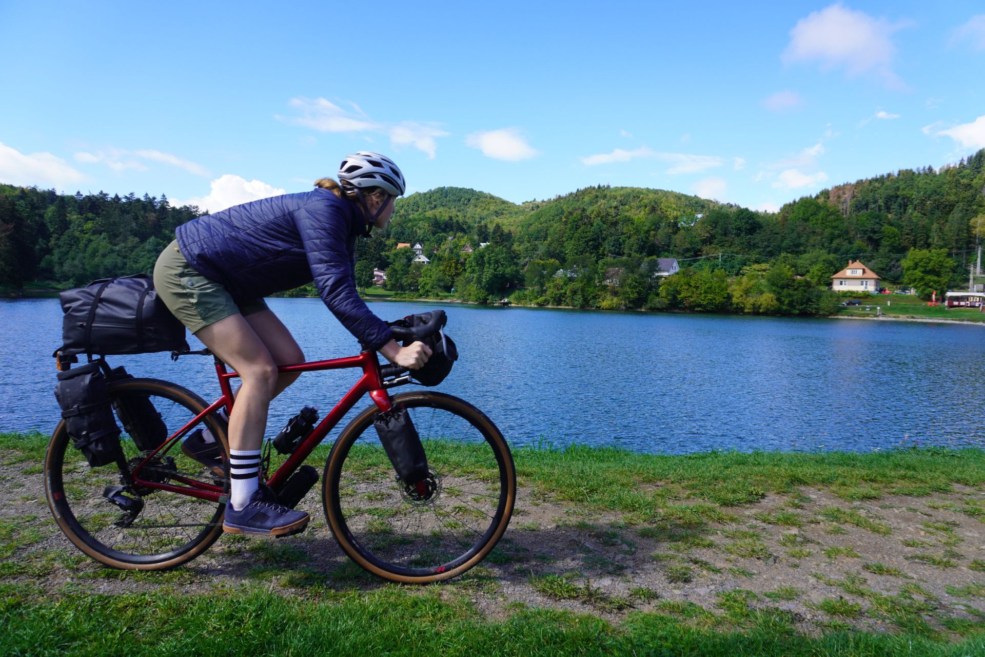Image shows Anna wearing the Crankbrothers Stamp Lace flat shoes while cycling.