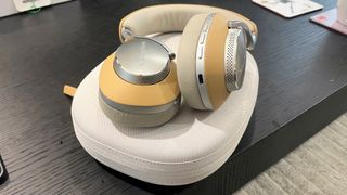 Hero image for best over-ear headphones showing Bowers & Wilkins Px8 in cream and tan on white carry case