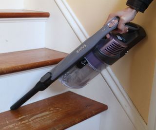 Testing the handheld mode of the Shark Pet Cordless Stick Vacuum on stairs