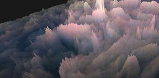 Spiky, fluffy-looking clouds rise up out of a reddish-pinkish haze high in the atmosphere of Jupiter.