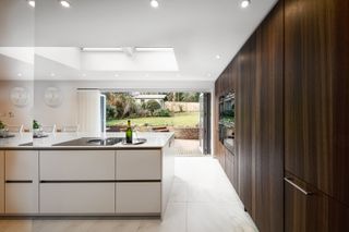 kitchen in extension with white and wood cabinetry