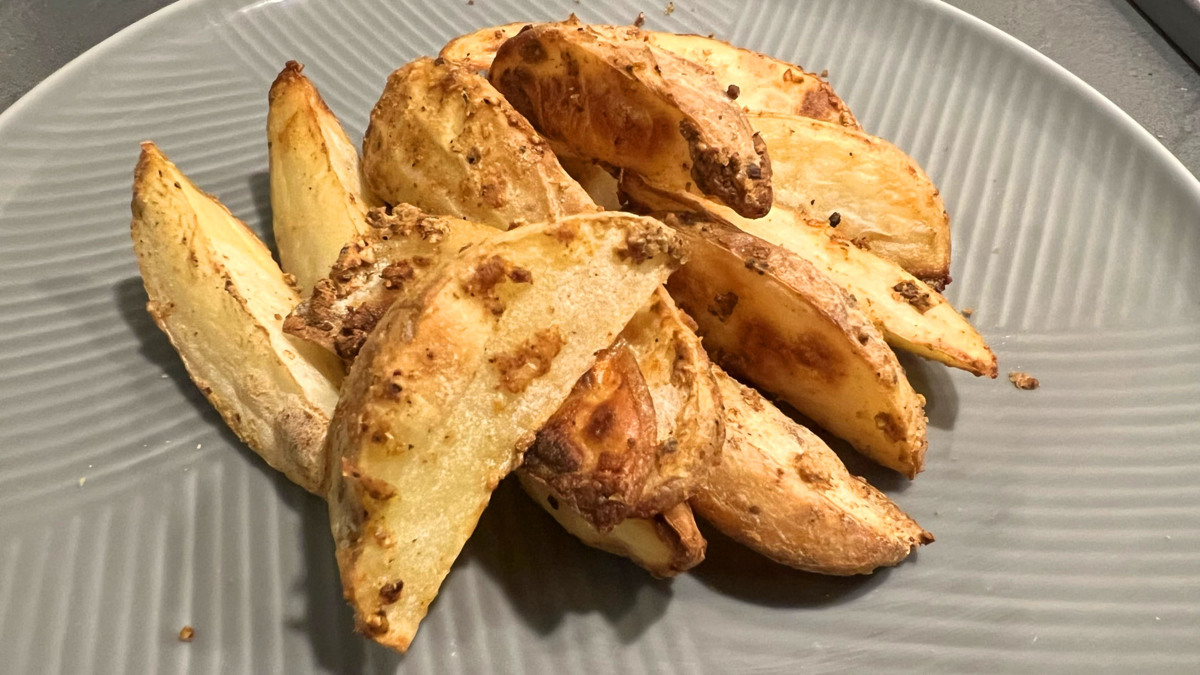 cooked potato wedges on a plate