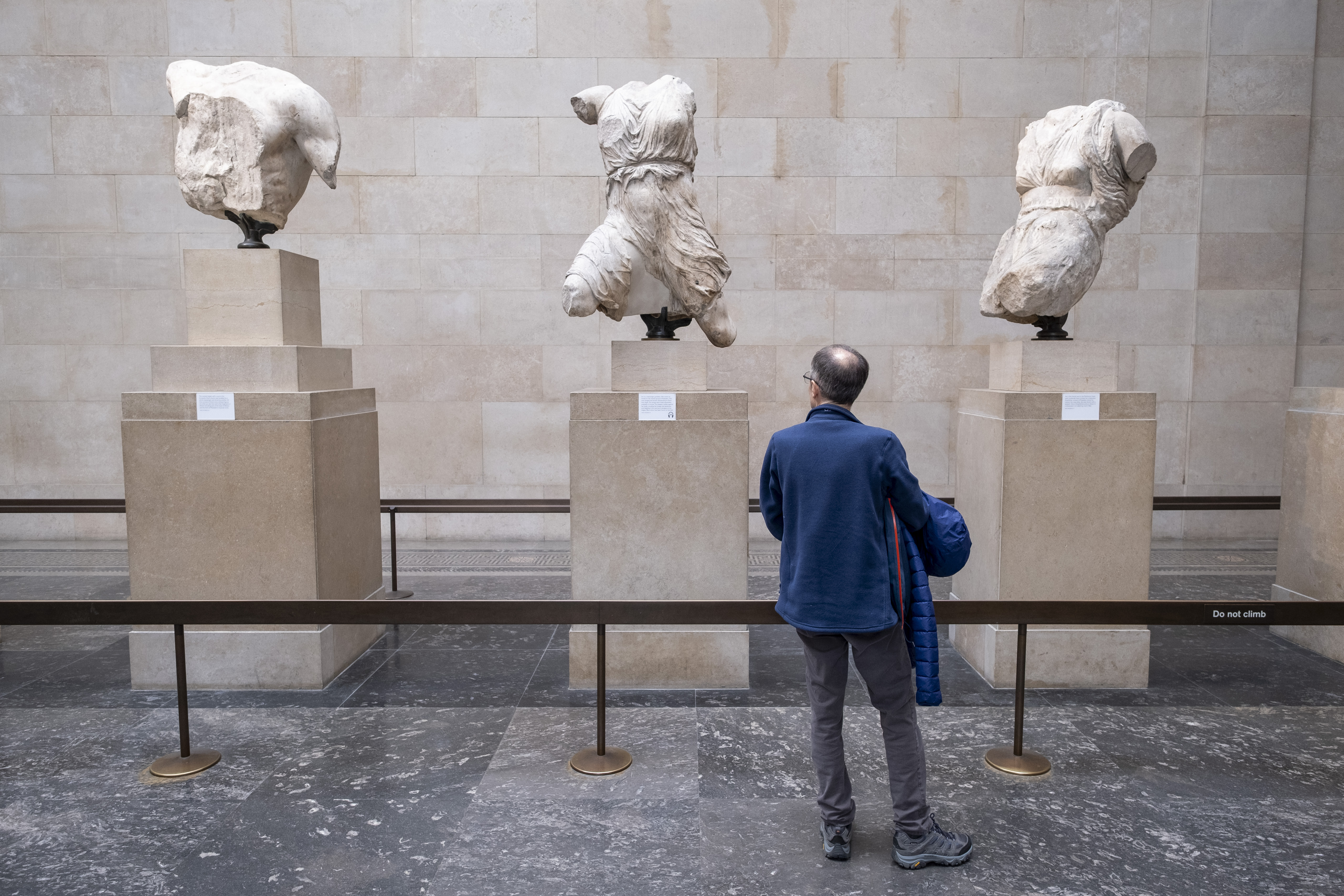 A man looks at the Elgin marbles in the British Museum in London