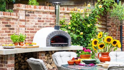 picture of a brick pizza oven in a garden 