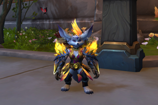 A fox-like World of Warcraft character wearing a golden armor set with shoulder pads that radiate a holy fire