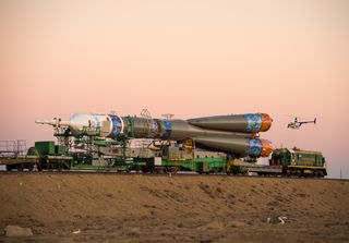Train Rolls Out Soyuz TMA-11M Rocket to Launch Pad