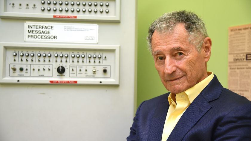 Dr. Leonard Kleinrock poses beside the first Interface Message Processor