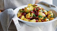 White bowl with potatoes and chorizo recipe