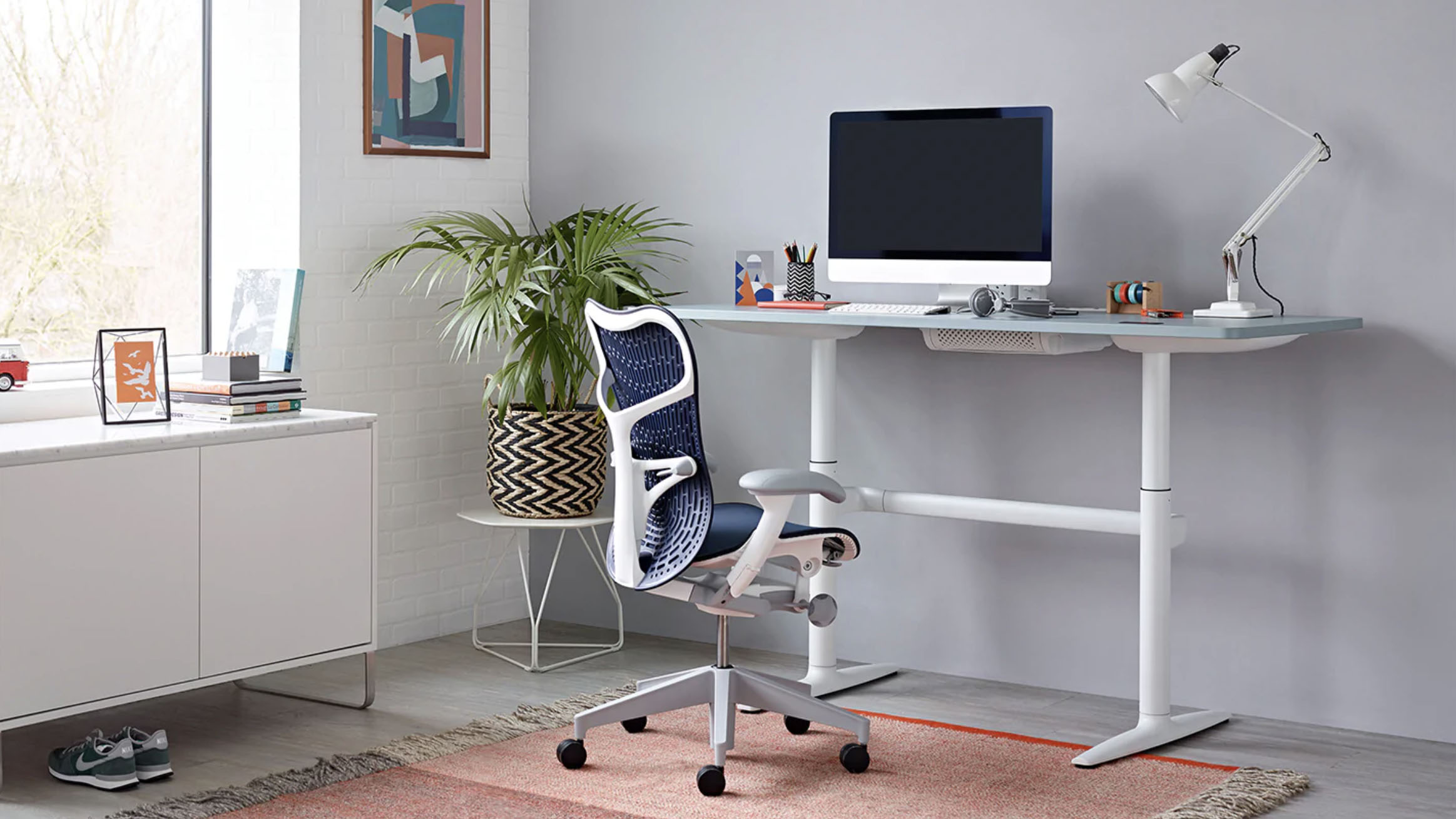 Herman Miller Mirra 2 chair next to desk