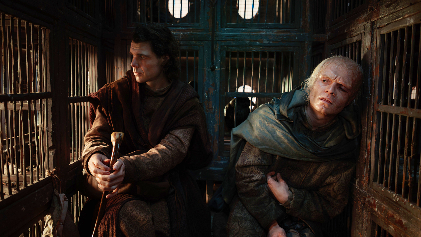 Larys and Aegon II sitting in a chicken coup in House of the Dragon season 3