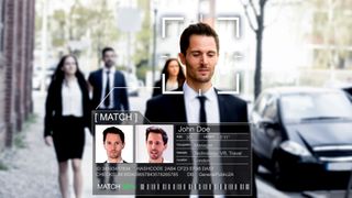 Man in business suit being matched through facial recognition
