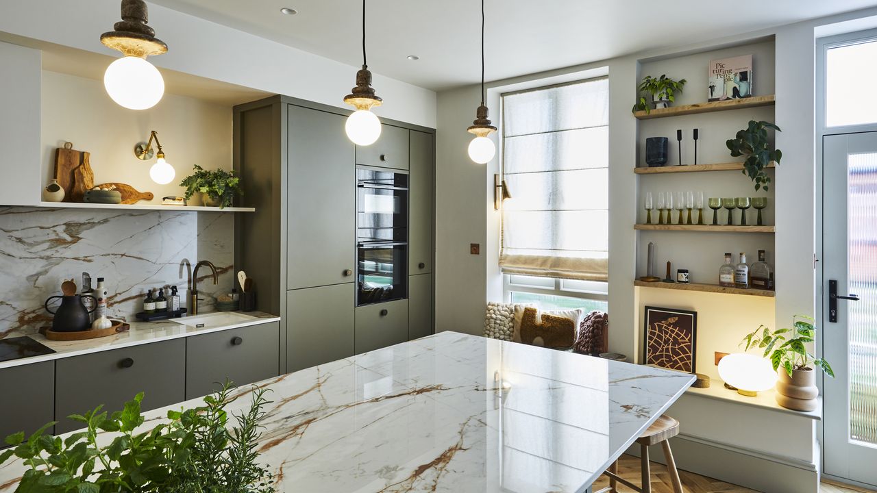 Green Magnet kitchen with island and pendant lights