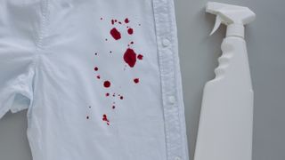 Blood stain on white shirt with spray bottle