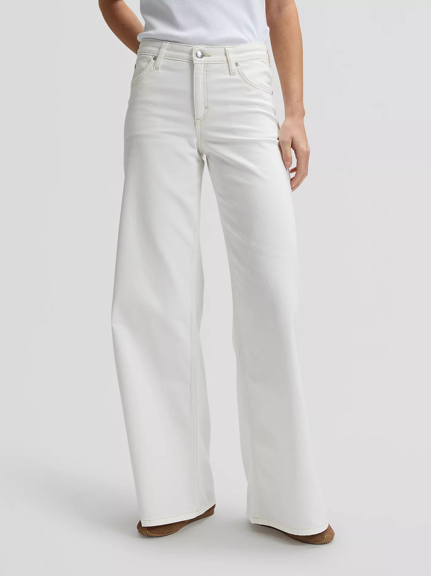 A pair of white mid rise slouchy jeans.