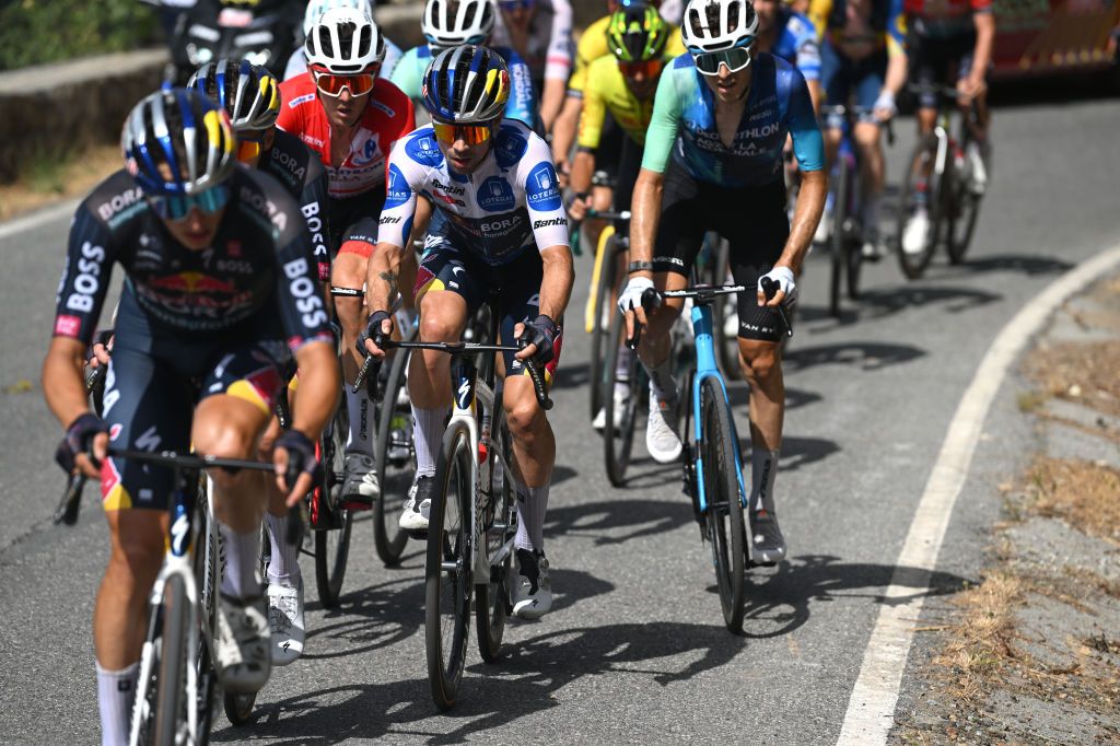 GRANADA SPAIN AUGUST 25 LR Ben OConnor of Australia and Team Decathlon AG2R La Mondiale Red Leader Jersey Primoz Roglic of Slovenia and Team Red Bull Bora hansgrohe Polka dot Mountain Jersey during the La Vuelta 79th Tour of Spain 2024 Stage 9 a 1785km stage from Motril to Granada UCIWT on August 25 2024 in Granada Spain Photo by Dario BelingheriGetty Images