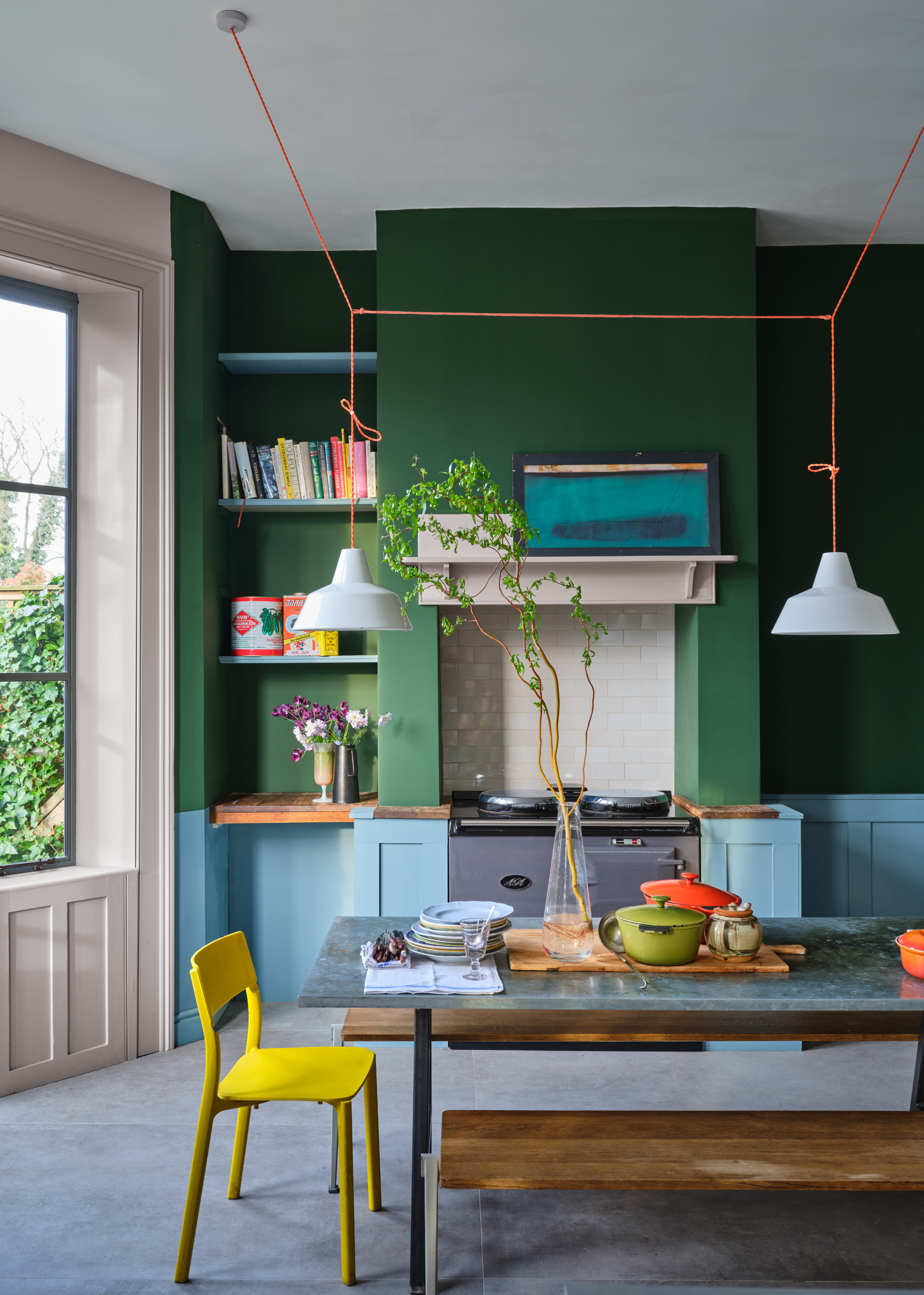 blue and green kitchen with hanging lights