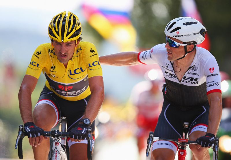 Fabian Cancellara crosses the line with teammate Markel Irizar on the Mur