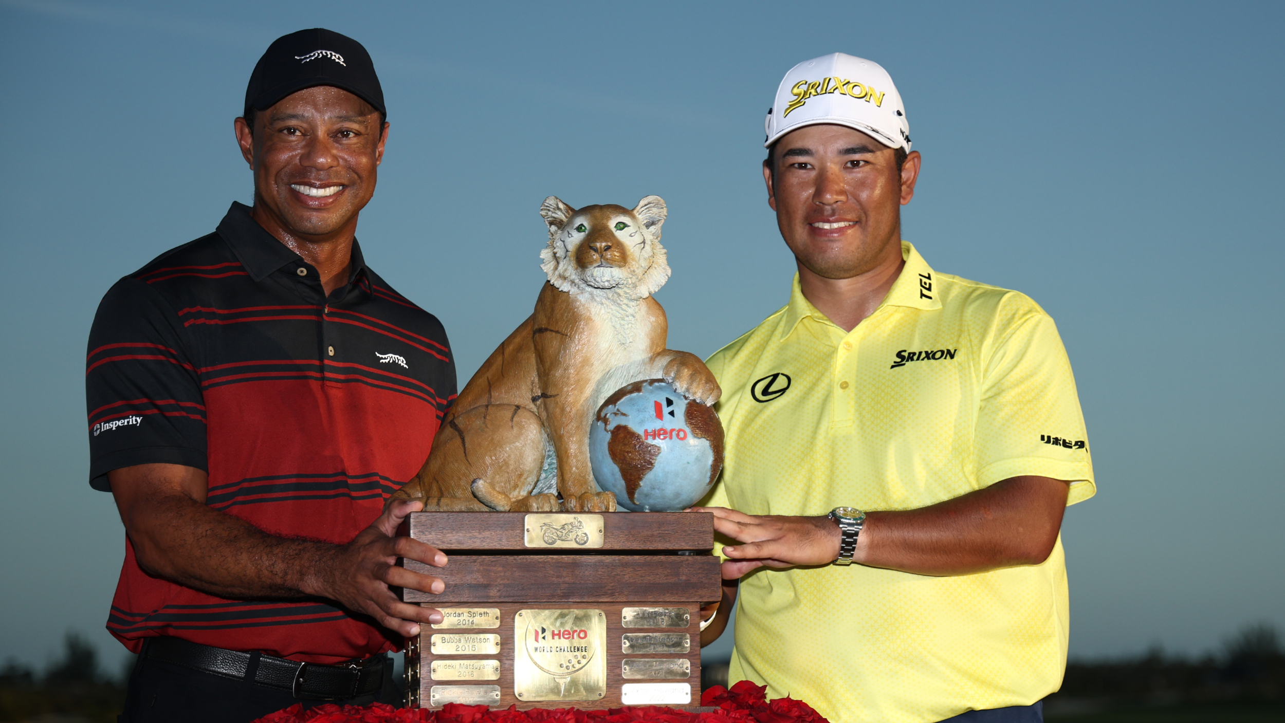 Tiger Woods presents Hideki Matsuyama with the Hero World Challenge trophy 