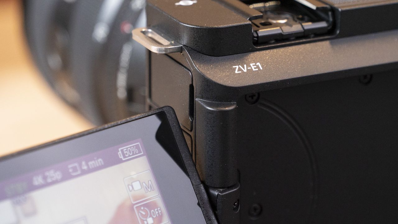 The Sony ZV-E1 camera sitting on a wooden table