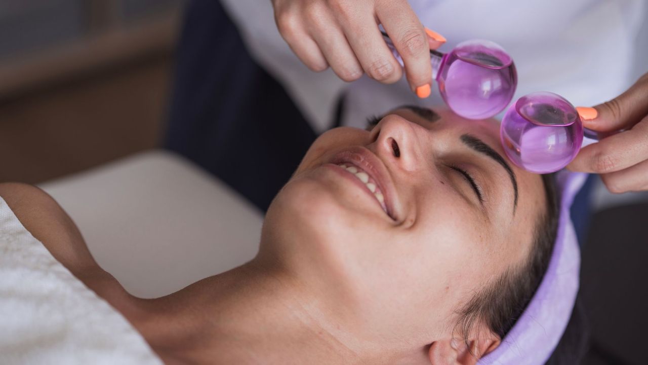 woman having a facial with ice globes - best ice globes