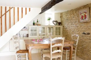 dining_room_chairs_stairs_cabinets_brickwork_beams